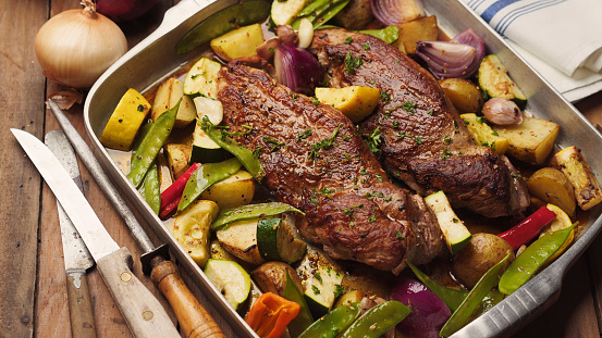 Tenderloins roasting with vegetables and potatoes