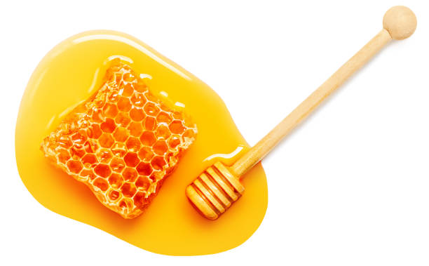 istock Honey stick and  Honeycomb isolated on white background, top view. 1438273147