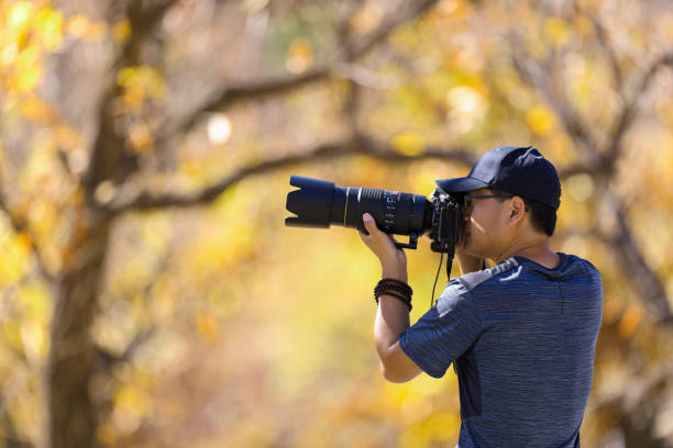 istock Side portrait of the photographer at work 1438274230