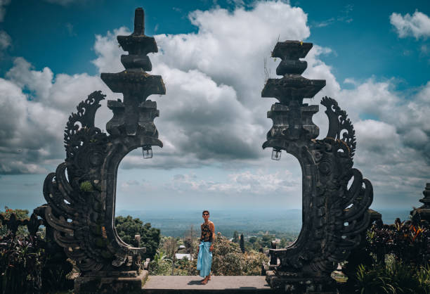 istock Young man explores temples in Bali 1438276408