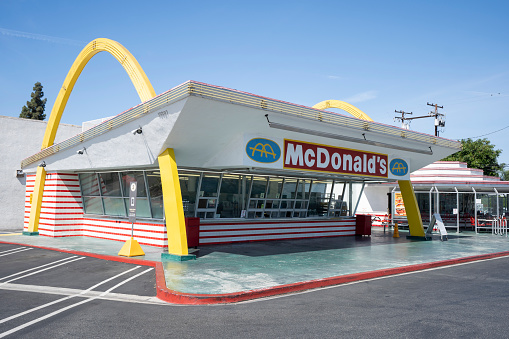 Downey, CA, USA - May 10, 2022: Front view of the oldest remaining McDonald's restaurant that sits in Downey, California, outside of Los Angeles. This location opened in 1953, and was the first location to have the \