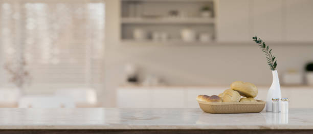 istock Elegance white marble kitchen tabletop with copy space over blurred background of modern kitchen 1438276700