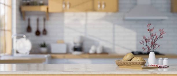 istock Minimal white marble kitchen tabletop with copy space over blurred Scandinavian kitchen style 1438276728