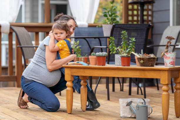 istock Loving mom and daughter gardening 1438278356