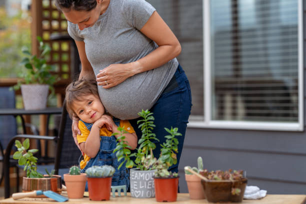 istock Loving mom and daughter gardening 1438278631