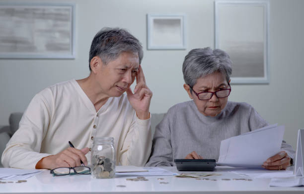 istock Asian retired husband and wife having money problems. 1438291631