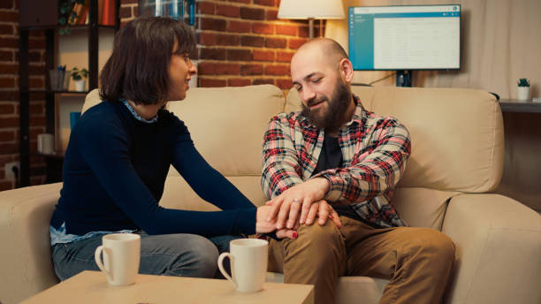 istock Husband and wife solving marriage problems at therapy session meeting 1438292682
