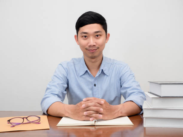 istock Handsome businessman sit at working table confident smile 1438292926