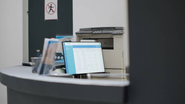 istock Hospital reception desk with computer to make appointments 1438294755