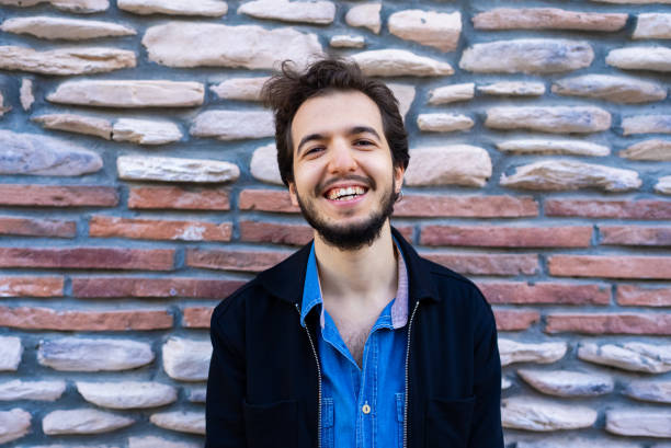 istock Portrait of a man with stone wall background 1438294833