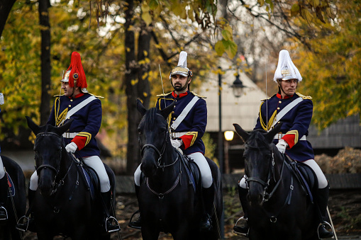 Bucharest, Romania - November 1, 2022: Mounted Romanian Jandarmi (horse riders from the Romanian Gendarmerie) in ceremonial and parade uniforms.