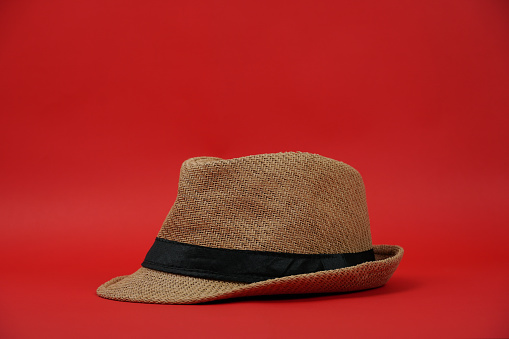 A hat on red color background. studio shoot.