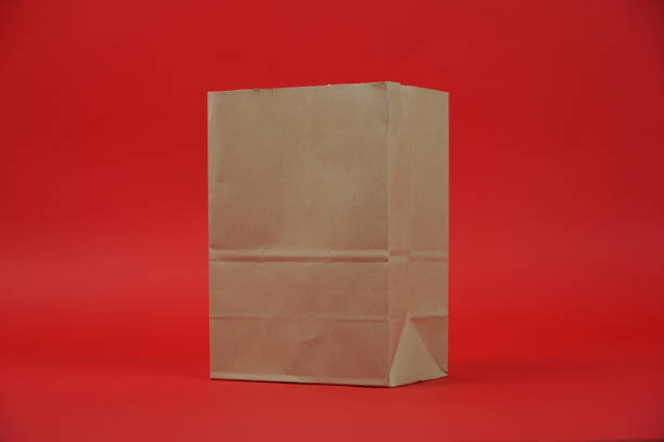 A paper bag on red color background. studio shoot.