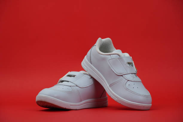 istock A shoes on red color background. 1438295308