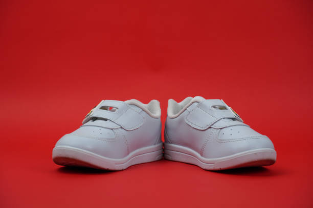 istock A shoes on red color background. 1438295318