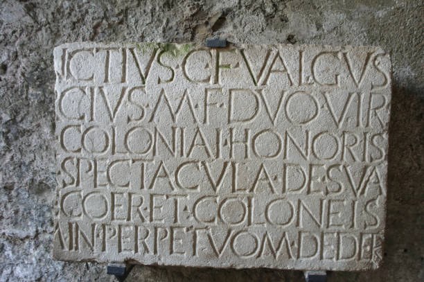 istock Letters carved into ancient stone 1438300382