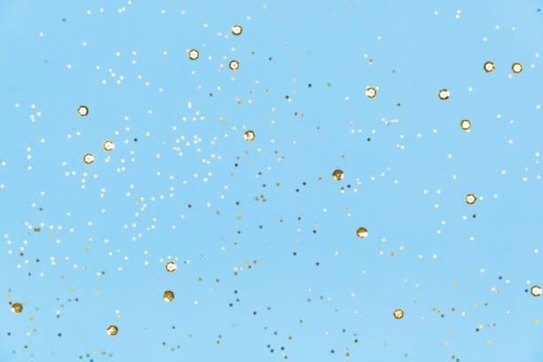 istock Blue background with golden sequins. Festive backdrop for your projects. Background for your product presentation. 1438300479