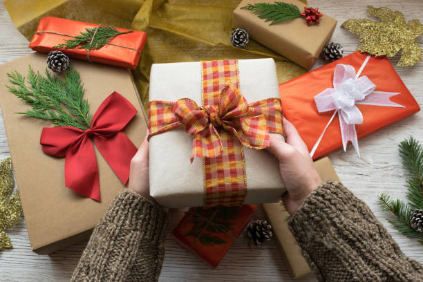 istock hands holding a christmas gift box 1438300827