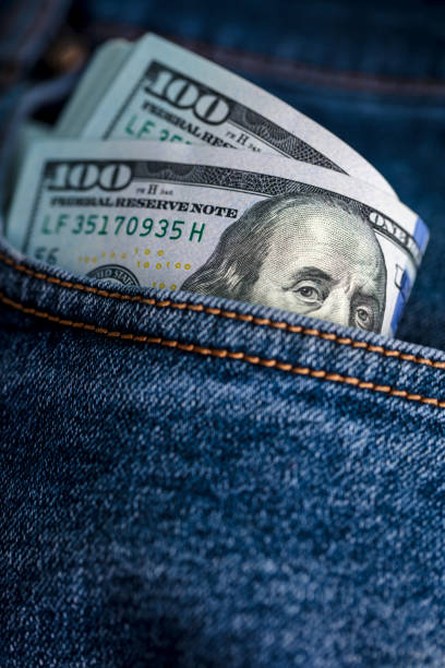 istock Dollar bills in jeans pocket 1438302226