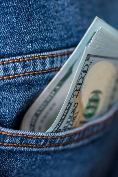 istock Dollar bills in jeans pocket 1438302272