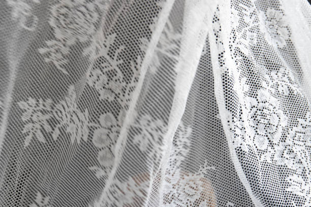Movement of White Lace Cutain Soft and Fragile movement of White Lace when the wind Blows through cutain stock pictures, royalty-free photos & images