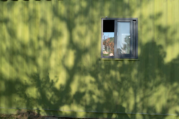 The sun shines on the wall of the converted container house
