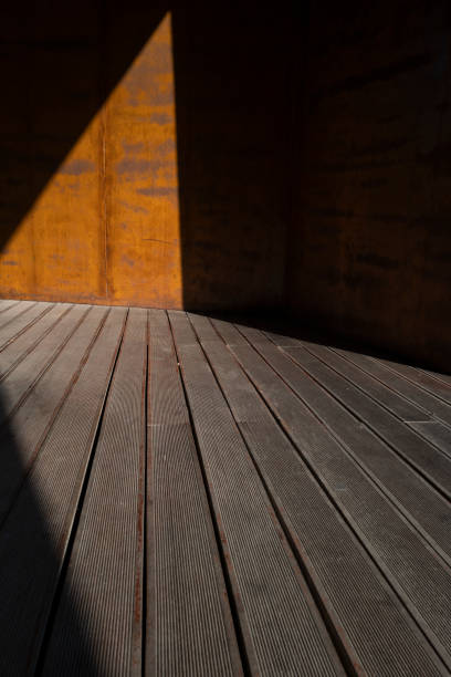 istock sun rays on wooden floor 1438303420