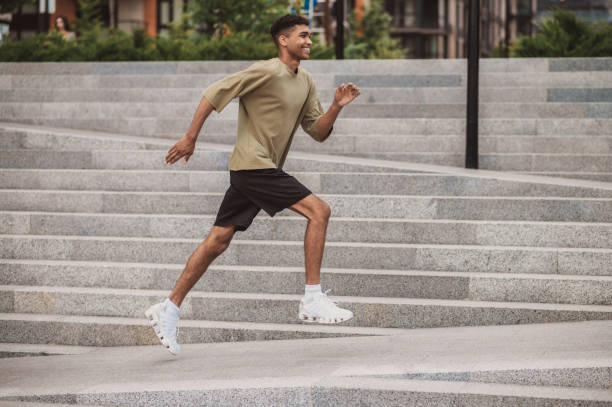 istock Young sportsman having a warming up excercising before the run 1438308366