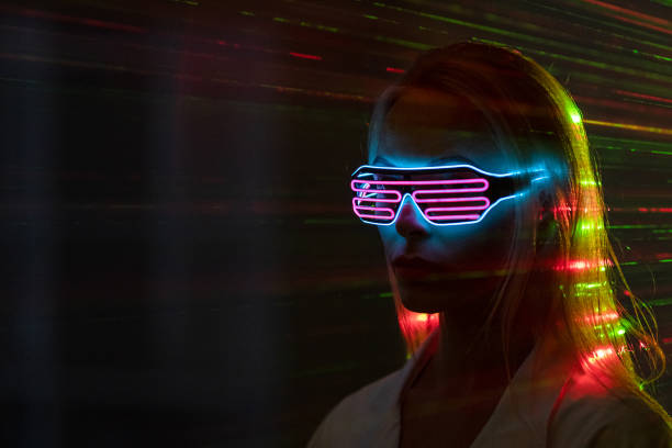 istock The woman in modern goggles on a laser rays backrground 1438313900