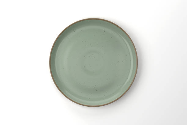 Green Ceramic Plate On White Background stock photo