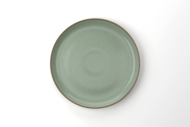 green ceramic plate on white background - plate ceramics pottery isolated imagens e fotografias de stock