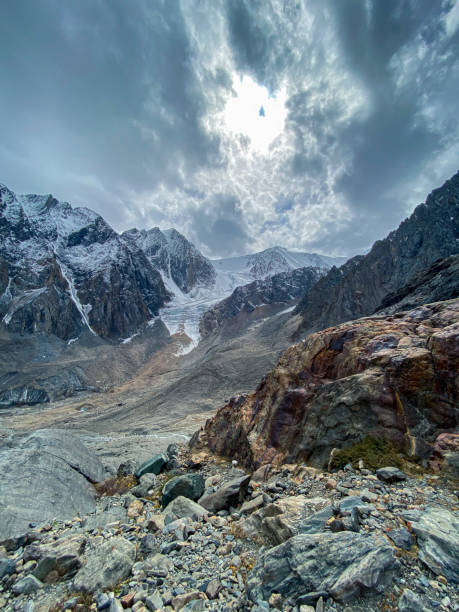 istock Beautiful landscape with rocky mountains under the clouds 1438317872