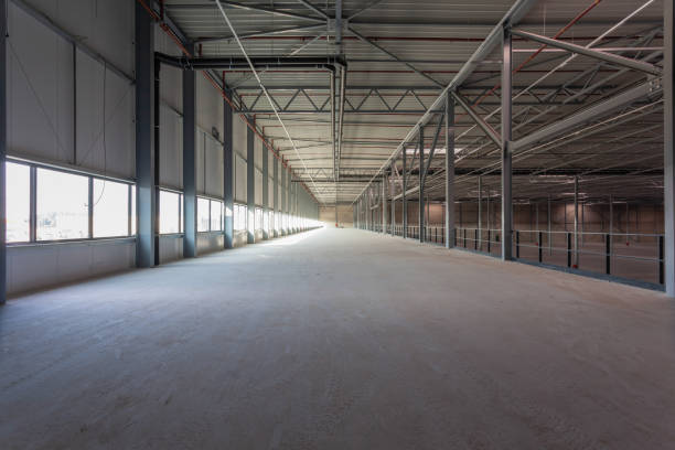 istock View inside a new empty warehouse on the mezzanine floor looking into the hall 1438317891