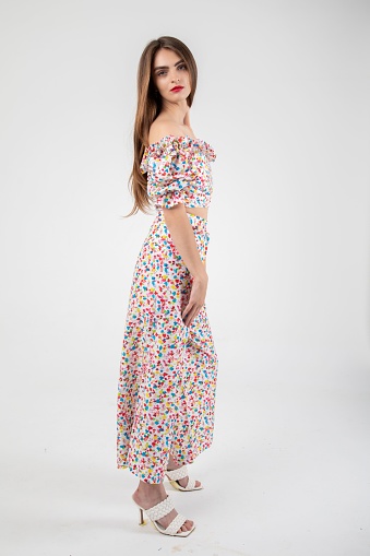 A stunning young Ukrainian model in a studio shoot with a floral culottes set on a light background