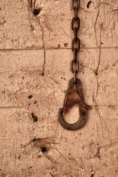 istock Closeup shot of an old rusty shackle on wall 1438318336