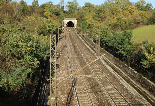 istock Empty railway  leading to a tunnel in the mountain. 1438318410