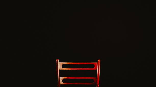 An old wooden chair back isolated on black background