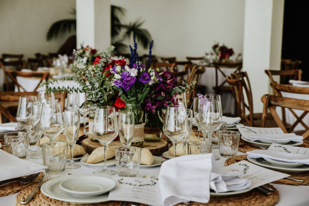 istock Beautiful table setup for a wedding reception with colorful flower arrangement centerpiece 1438319404