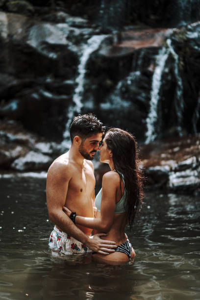 istock Young romantic couple enjoying their time together in a river 1438320780