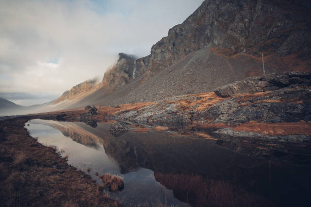 istock Beautiful landscape of rocky cliffs reflected on a clean stream in Iceland 1438320842