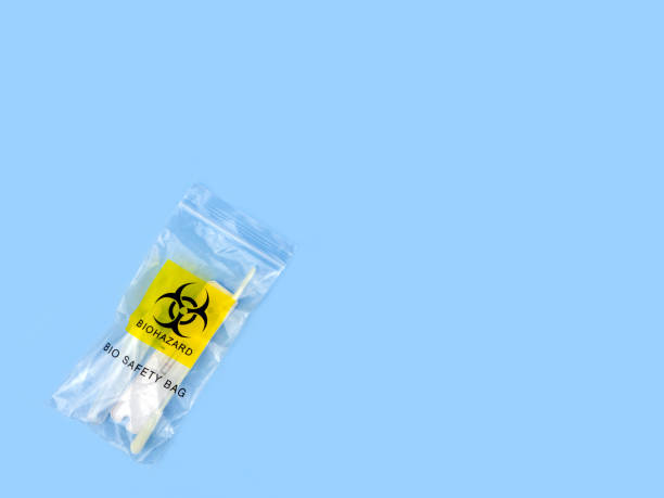 coronavirus rapid test kit in a plastic zip bag with biohazard logo. used atk in zip bag. copy space blank area for text. - cotton swab audio imagens e fotografias de stock