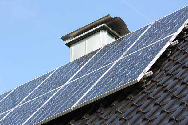 istock Closeup of solar panel on the blue sky background 1438322066