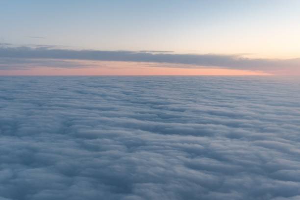 istock Beautiful shot of a blue sky over a cloudscape during the sunset 1438322077