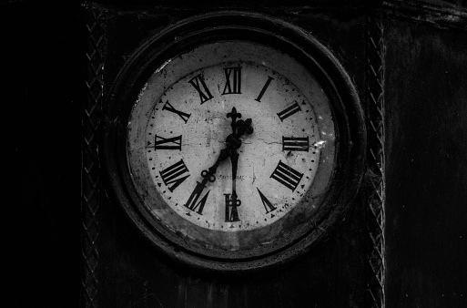 Braga, Portugal – July 27, 2022: A closeup black and white view of an old clock in public park in Braga city, Portugal