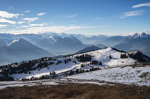 Panoramic shot of the Rigi Mountains in Arth Switzerland, under a blue sky during winter