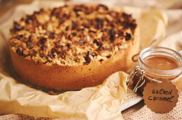 istock Apple pie topped with crumble and roasted nuts with salted caramel 1438323642
