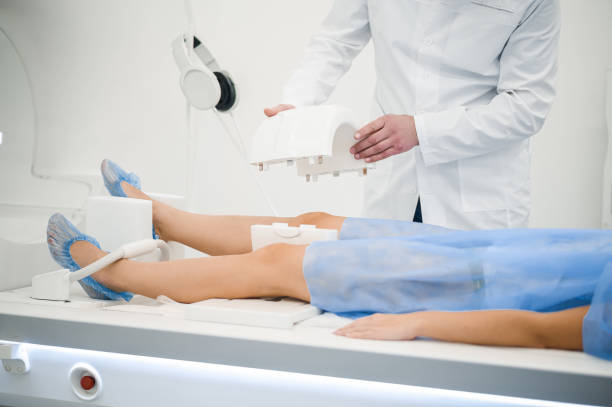istock Gray-haired mature medical specialist working with MRI scanner 1438324255