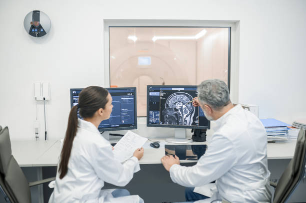 istock Colleagues discussing MRI results 1438324307