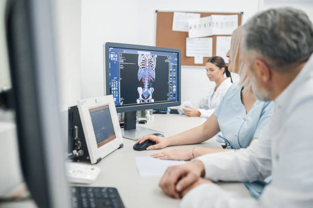 istock Doctors working in the diagnostic center and looking involved 1438324320
