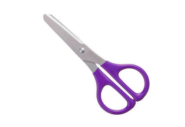 violet plastic handle closed scissors stock photo